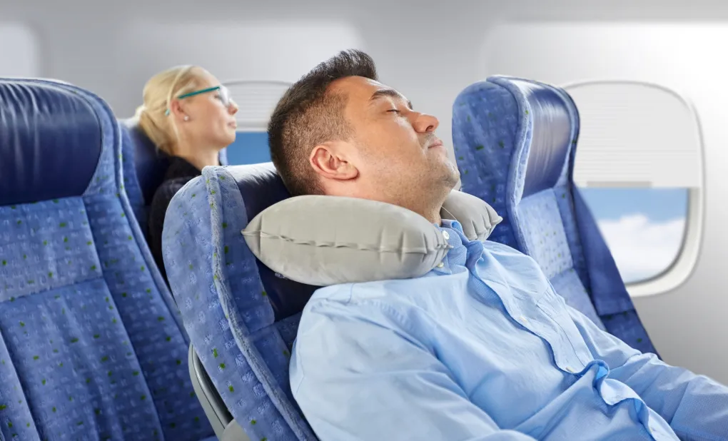 sleep-well-on-a-plane-tips-tricks